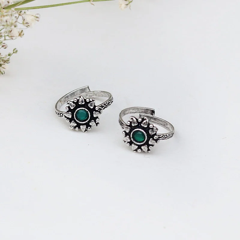 Rings with lotus flower engravings for peace -Teejh Miraya Green Stone Silver Oxidised Toe Rings